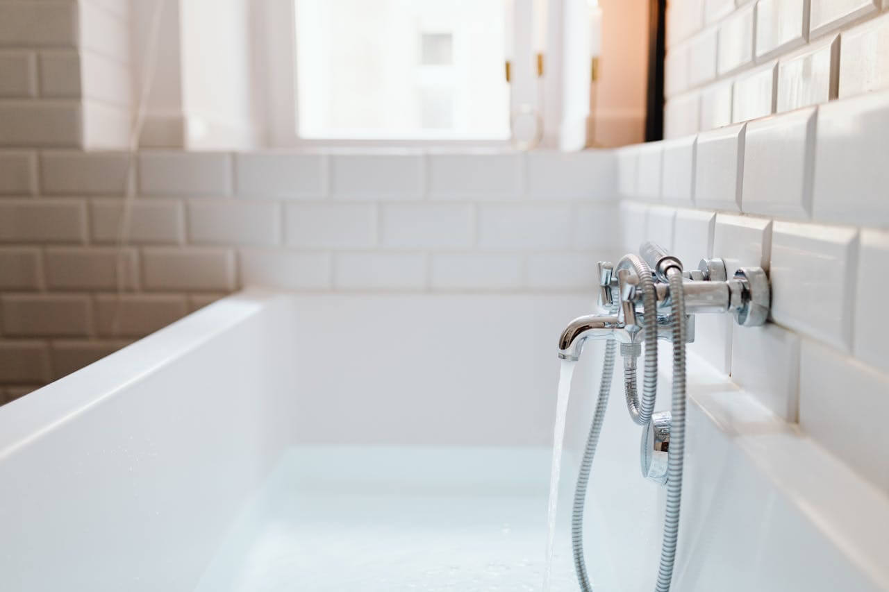 bathtub with running water